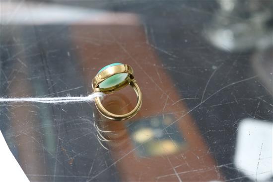 A 1950s 22ct gold and sardonyx set oval ring, carved with head of a Roman soldier to sinister, size K.